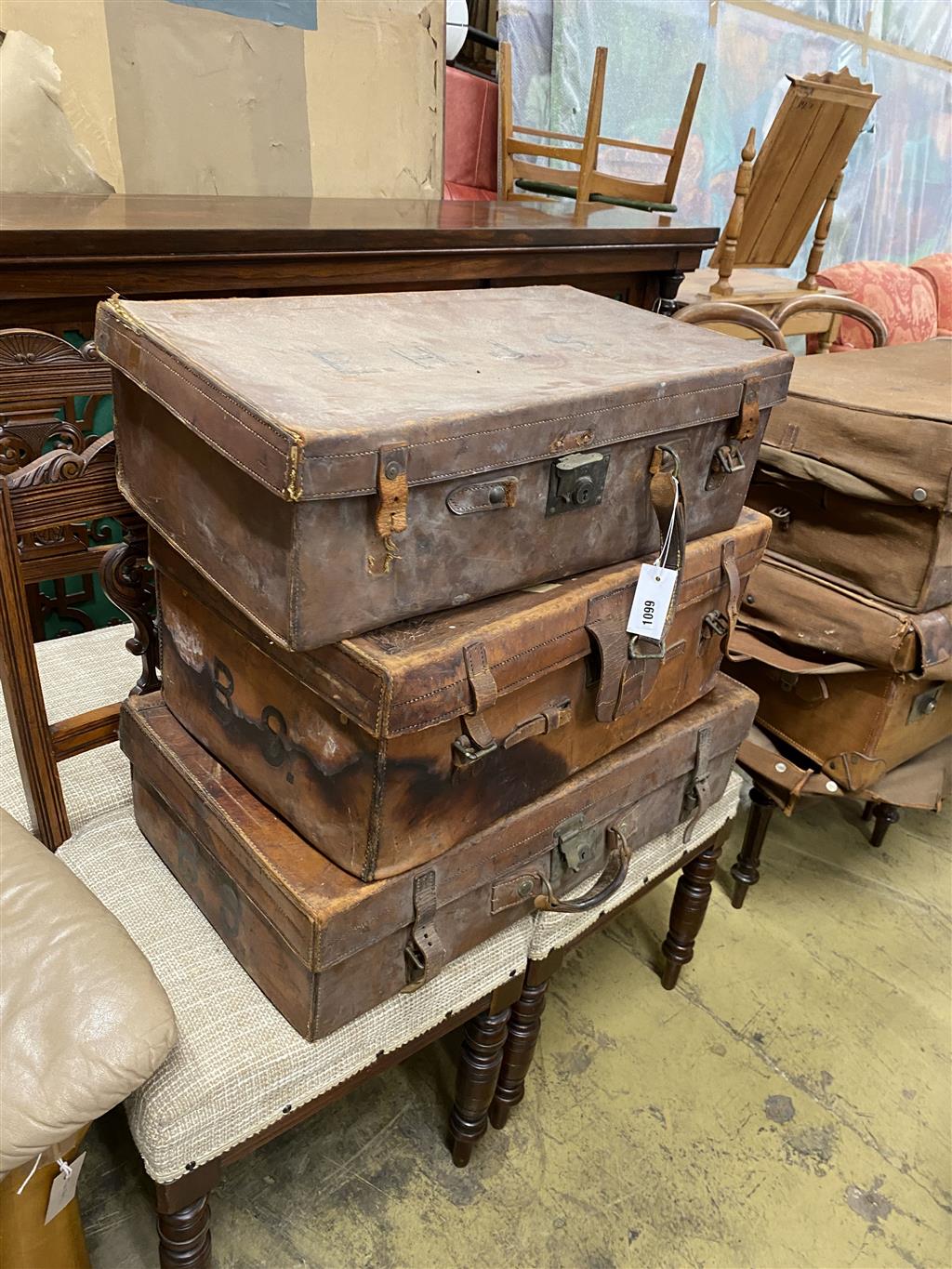 Five various brown leather suitcases, largest 80cm wide
